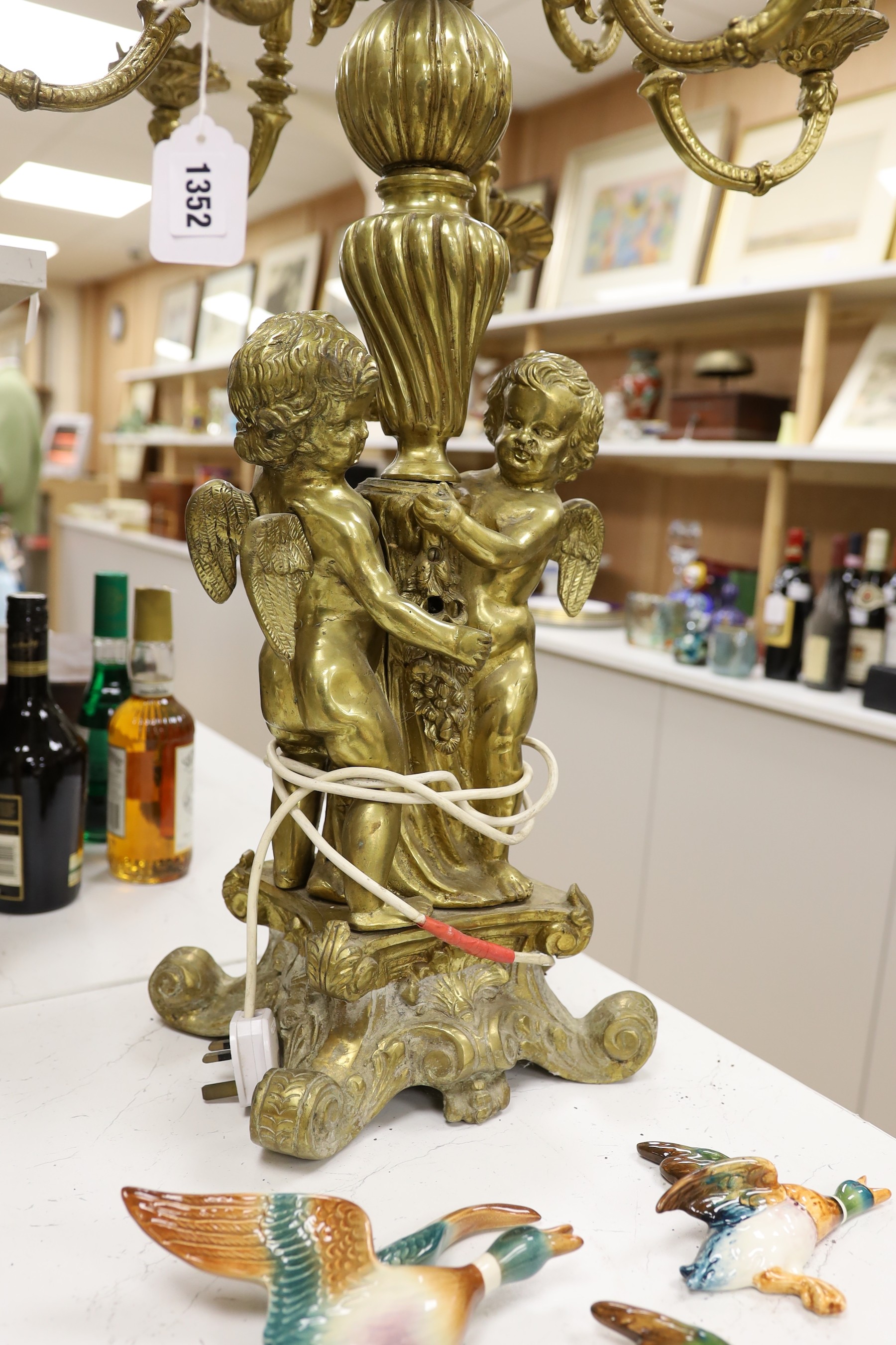 A pair of heavy brass candelabra, 85cm total height